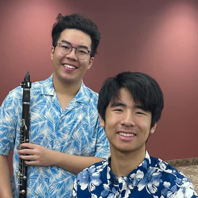 Enda Du and Caden Zhang, the Bossa Boys, in performance attire